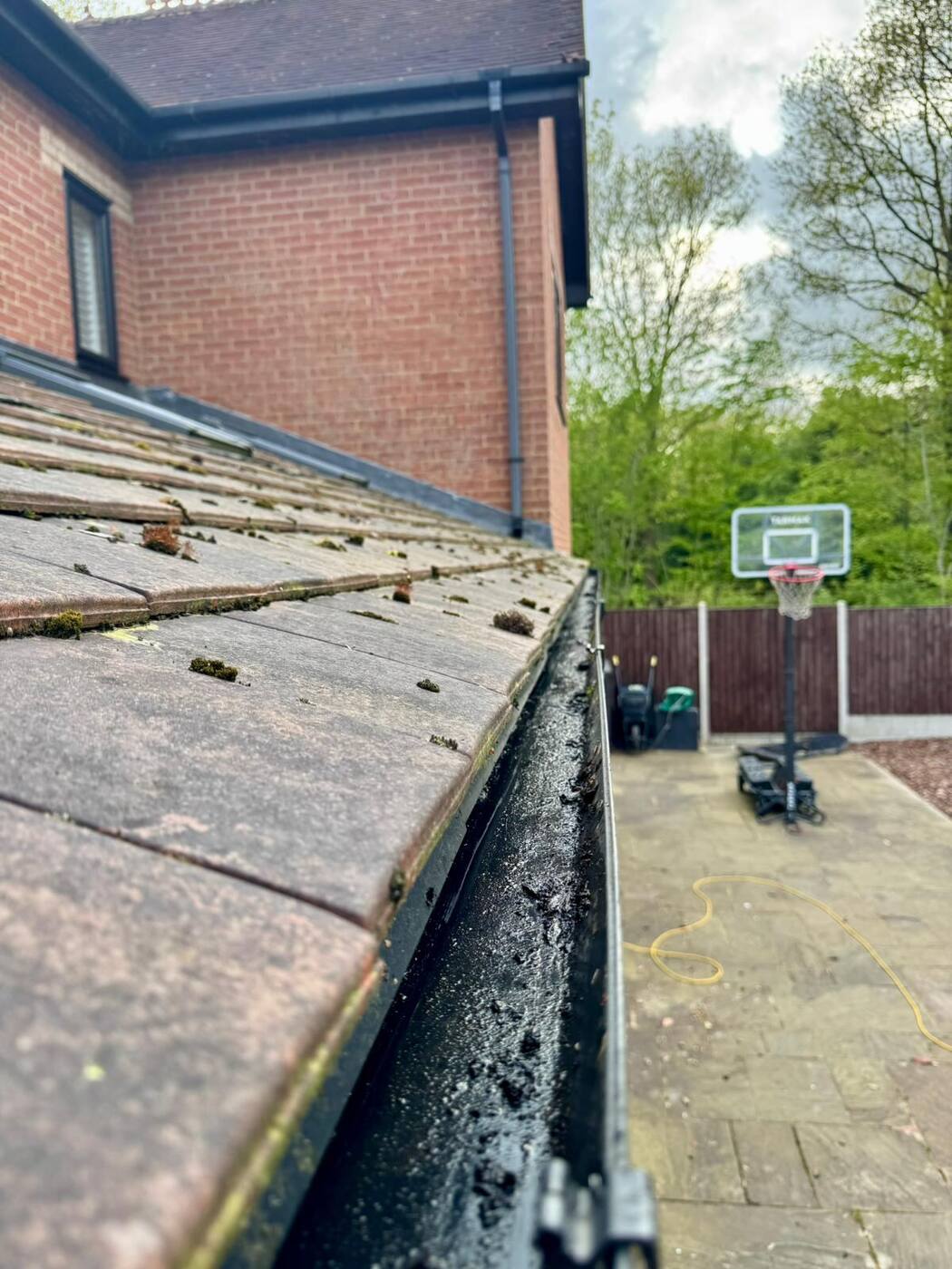 Newly cleaned gutter on a Milton Keynes home fully cleared of moss, leaves and debris