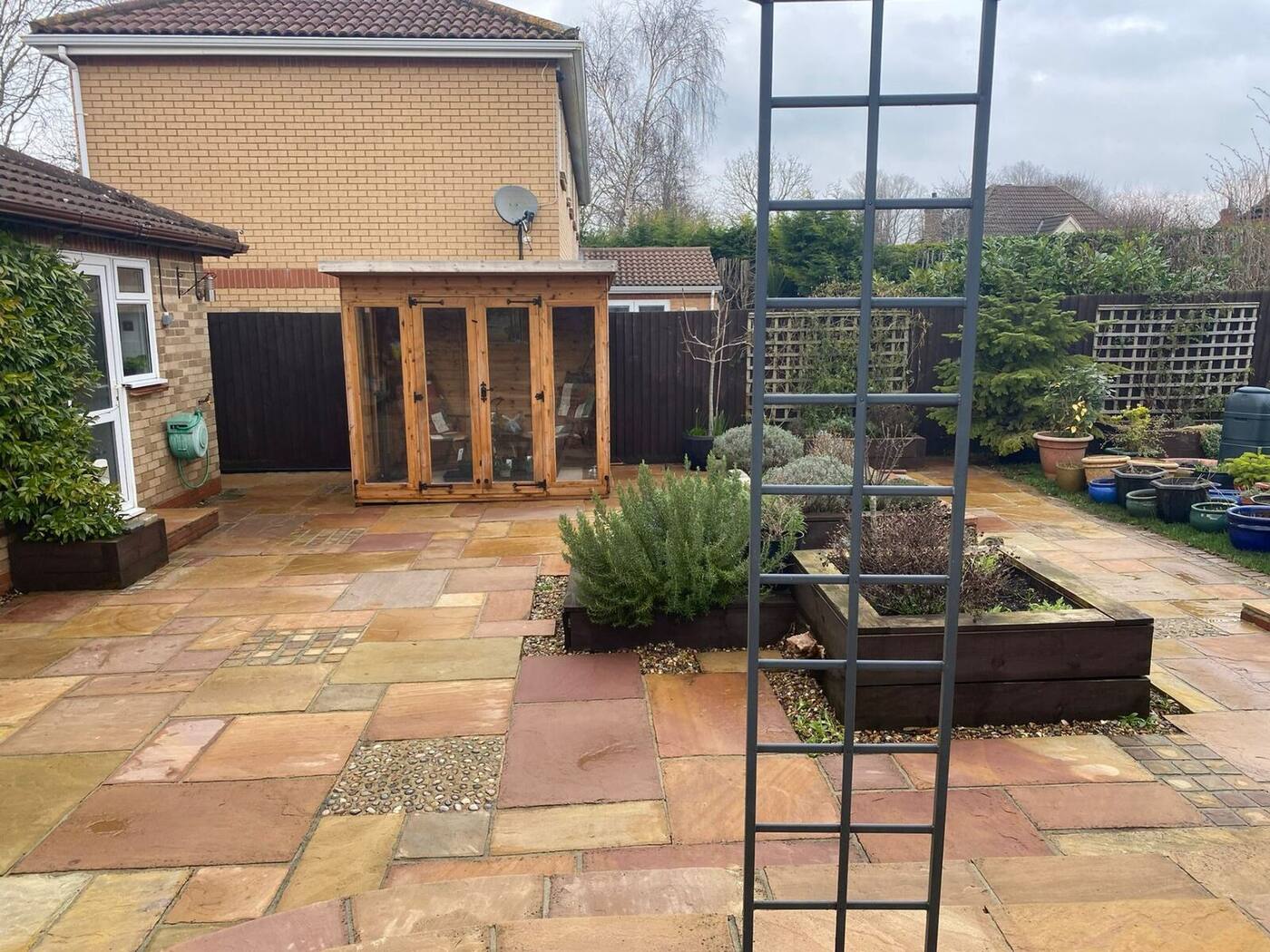 Beautifully restored sandstone patio after professional pressure washing